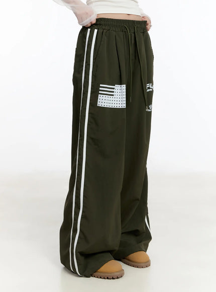 graphic-wide-leg-track-pants-cm511