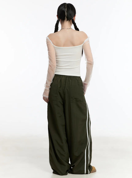 graphic-wide-leg-track-pants-cm511