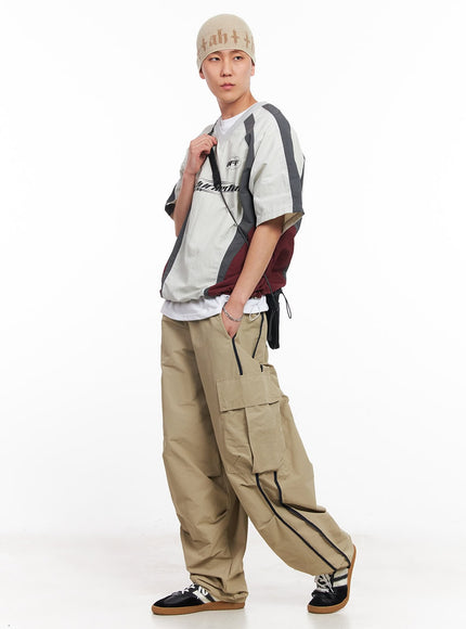 men-s-cargo-balloon-fit-windbreaker-pants-beige-iu512